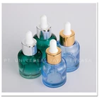 Empty fancy 20 30 ml cosmetic face serum press pump dropper bottle glass packaging with press pump dropper cap  7